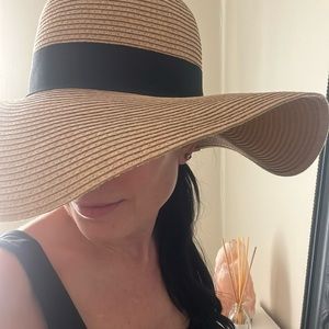 Straw beach hat with black ribbon detail floppy rim